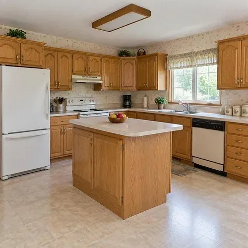 Classic 1990s golden oak kitchen cabinets in Lincoln, NE before painting